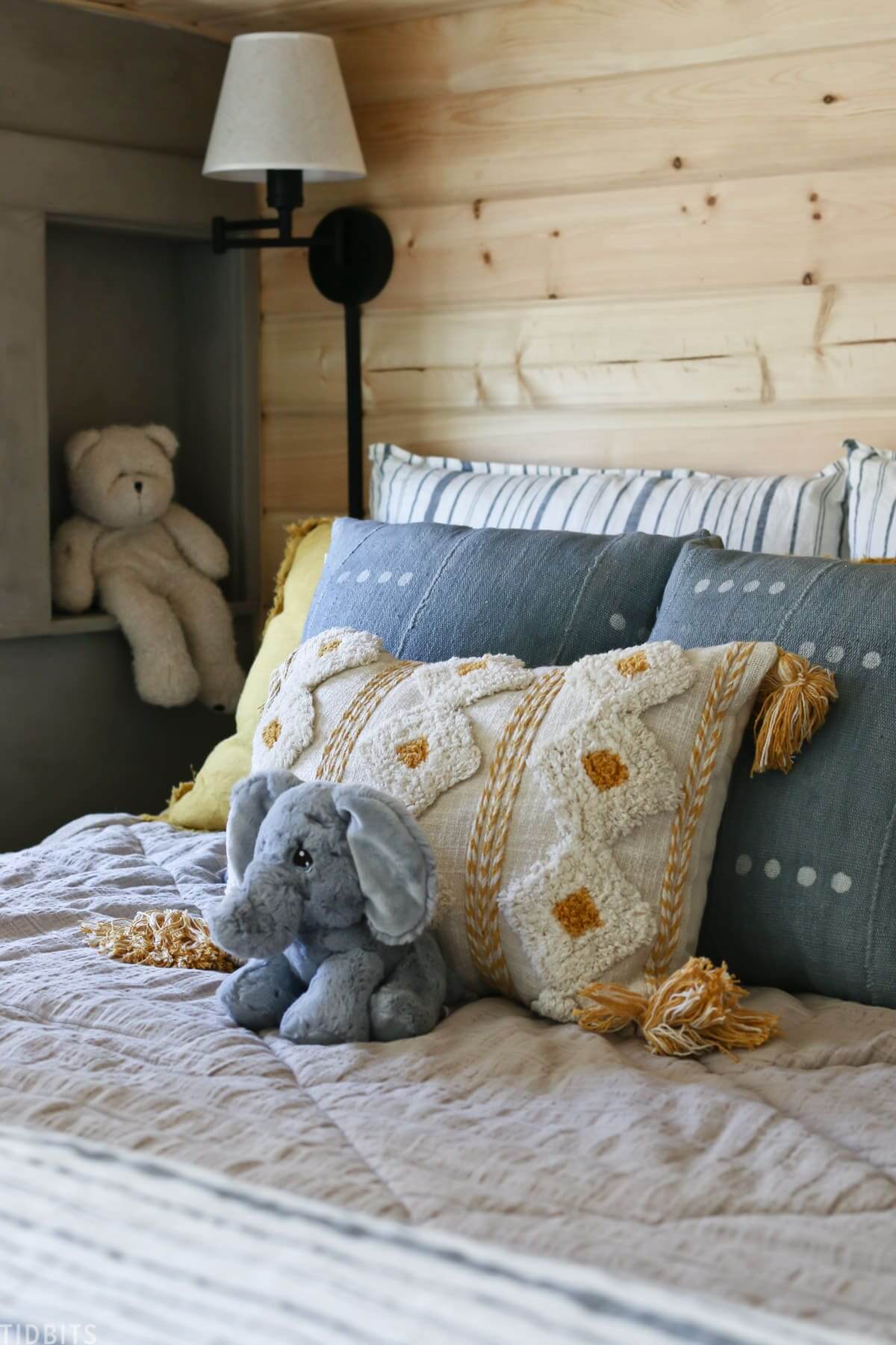 A serene bedroom setting with a custom pillow on the bed.