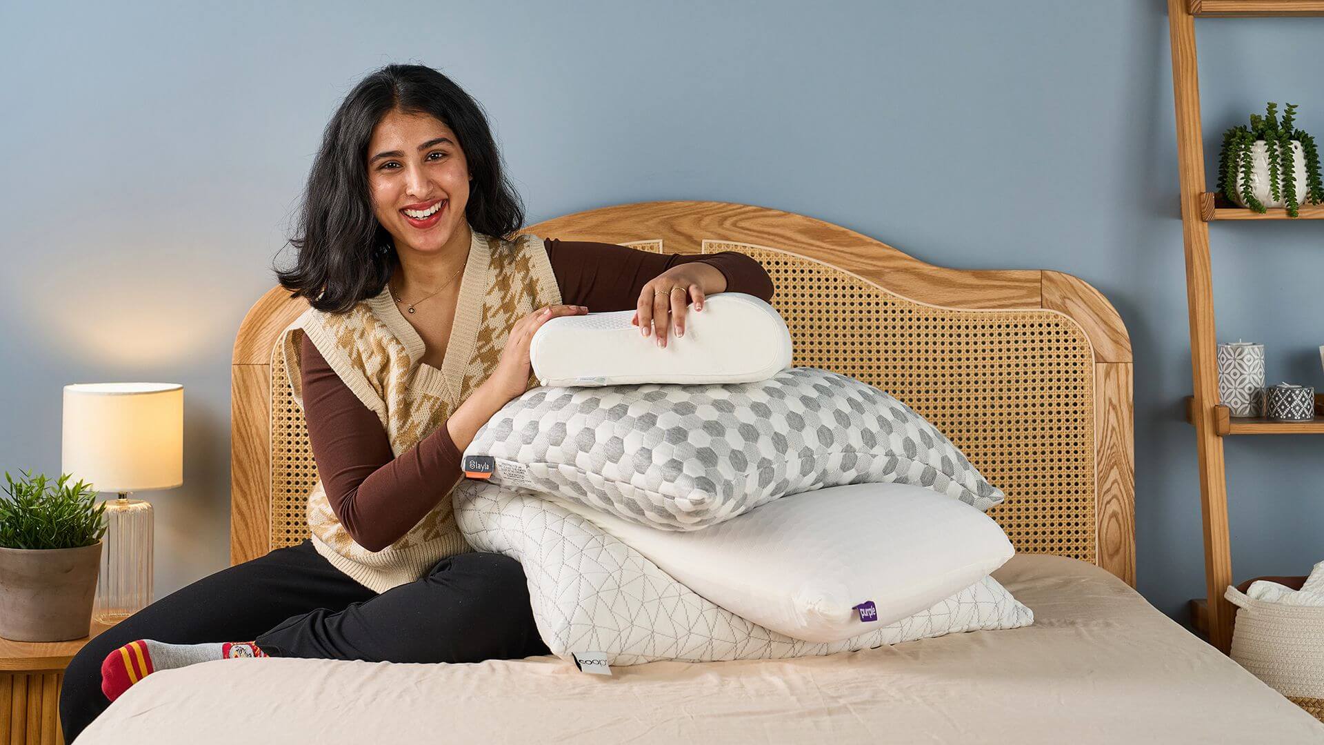 A sleep expert discussing pillow options with a client.